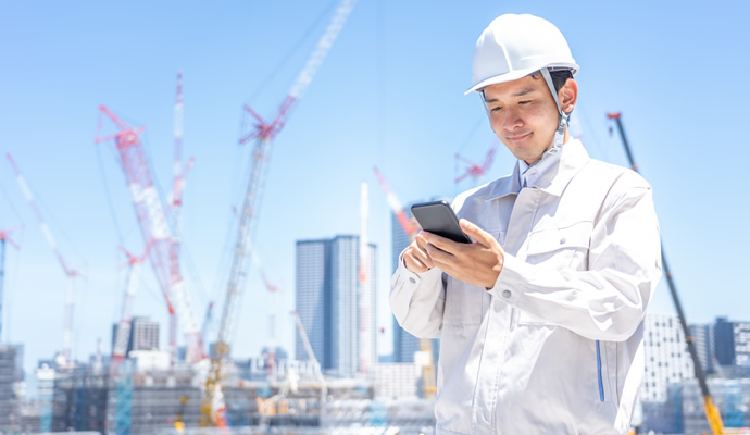 Image of construction manager checking data